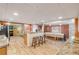 Open kitchen and dining area with island and bar seating, perfect for entertaining at 130 Indian Creek Rd, Oak Hill, FL 32759