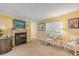 Welcoming living area centered around a fireplace, ideal for relaxation at 130 Indian Creek Rd, Oak Hill, FL 32759