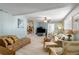 Bright and airy living area with comfortable furniture and elevated area at 130 Indian Creek Rd, Oak Hill, FL 32759