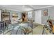 Casual living room featuring a dining area and outdoor access at 130 Indian Creek Rd, Oak Hill, FL 32759