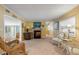 Cozy living area with a fireplace, comfortable seating, and charming decor at 130 Indian Creek Rd, Oak Hill, FL 32759