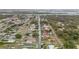 Aerial view highlighting the property's waterfront location in the community at 130 Indian Creek Rd, Oak Hill, FL 32759