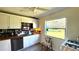 Bright kitchen with wood countertop and stainless steel dishwasher at 131 W Palm Way, Edgewater, FL 32132