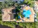 Condo community featuring a star shaped pool and lush landscaping at 1401 S Palmetto Ave # 119, Daytona Beach, FL 32114