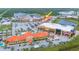 Aerial view showcasing a commercial building among other businesses and parking areas at 1653 N Us Highway 1 # 201, Ormond Beach, FL 32174