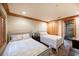 Bedroom with two twin beds, wood floors, and plantation shutters at 1653 N Us Highway 1 # 201, Ormond Beach, FL 32174