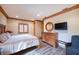 Spacious bedroom with wood furniture and large bed at 1653 N Us Highway 1 # 201, Ormond Beach, FL 32174