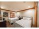 Spacious bedroom with two twin beds, wood floors, and plantation shutters at 1653 N Us Highway 1 # 201, Ormond Beach, FL 32174