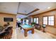 Basement game room featuring a pool table, bar, and seating area at 1653 N Us Highway 1 # 201, Ormond Beach, FL 32174