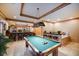 Basement game room features a pool table, wet bar, and seating at 1653 N Us Highway 1 # 201, Ormond Beach, FL 32174