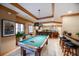 Game room with pool table, wet bar, and plenty of seating at 1653 N Us Highway 1 # 201, Ormond Beach, FL 32174