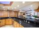 Kitchen features wood cabinets and a large island at 1653 N Us Highway 1 # 201, Ormond Beach, FL 32174