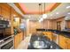 Kitchen boasts wood cabinets and stainless steel appliances at 1653 N Us Highway 1 # 201, Ormond Beach, FL 32174