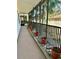 Screened balcony with potted plants and view of trees at 200 S Riverside Dr # 2010, New Smyrna Beach, FL 32168