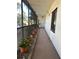 Shared balcony with potted plants and building exterior view at 200 S Riverside Dr # 2010, New Smyrna Beach, FL 32168
