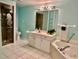 Bathroom boasts a large vanity, a soaking tub and a shower at 200 S Riverside Dr # 2010, New Smyrna Beach, FL 32168