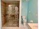 Walk-in shower with a built-in seat and seahorse etched glass at 200 S Riverside Dr # 2010, New Smyrna Beach, FL 32168