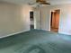 Large bedroom with ample closet space and carpeting at 200 S Riverside Dr # 2010, New Smyrna Beach, FL 32168
