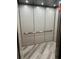 Simple and modern elevator interior with wood-look floor at 200 S Riverside Dr # 2010, New Smyrna Beach, FL 32168