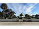 Gated entrance to a community with palm trees at 200 S Riverside Dr # 2010, New Smyrna Beach, FL 32168