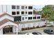 Building exterior showcasing a condo with balconies and landscaping at 200 S Riverside Dr # 2010, New Smyrna Beach, FL 32168