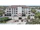 Three-story building with parking and landscaping at 200 S Riverside Dr # 2010, New Smyrna Beach, FL 32168