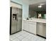 Kitchen with stainless steel refrigerator and dishwasher at 200 S Riverside Dr # 2010, New Smyrna Beach, FL 32168