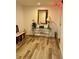 Lobby area with console table, mirror, and wood-look floors at 200 S Riverside Dr # 2010, New Smyrna Beach, FL 32168