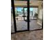 Bright building entrance with tiled floors and view of parking at 200 S Riverside Dr # 2010, New Smyrna Beach, FL 32168