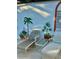 Relaxing patio area with lounge chairs and tropical mural at 200 S Riverside Dr # 2010, New Smyrna Beach, FL 32168
