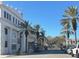 Scenic street view showing palm trees and local businesses at 200 S Riverside Dr # 2010, New Smyrna Beach, FL 32168