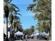 Street scene showcasing an outdoor market and palm trees at 200 S Riverside Dr # 2010, New Smyrna Beach, FL 32168