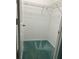 Spacious walk-in closet with wire shelving and teal carpeting at 200 S Riverside Dr # 2010, New Smyrna Beach, FL 32168