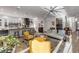 Elegant living room with a stylish sofa, armchairs, and a partial view of the kitchen and wine cellar at 2022 N Peninsula Ave, New Smyrna Beach, FL 32169