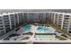 Aerial of building, pool, and oceanfront location at 2401 S Atlantic Ave # C206, New Smyrna Beach, FL 32169