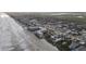 Aerial view showing beachfront property, ocean, and surrounding neighborhood at 2401 S Atlantic Ave # C206, New Smyrna Beach, FL 32169