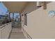 Private balcony overlooking palm trees and ocean glimpses at 2401 S Atlantic Ave # C206, New Smyrna Beach, FL 32169
