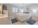 Relaxing main bedroom with king-sized bed, white and blue decor at 2401 S Atlantic Ave # C206, New Smyrna Beach, FL 32169