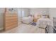 Guest bedroom with twin beds and light wood dresser at 2401 S Atlantic Ave # C206, New Smyrna Beach, FL 32169