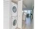 Laundry room with stacked washer and dryer at 2401 S Atlantic Ave # C206, New Smyrna Beach, FL 32169