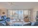 Living room with ocean view and comfy seating at 2401 S Atlantic Ave # C206, New Smyrna Beach, FL 32169