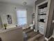 Clean bathroom with soaking tub, toilet, and linen storage at 2729 Pine Tree Dr, Edgewater, FL 32141