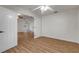 Bedroom with door to adjacent room and wood-look floors at 2853 Turnbull Estates Dr, New Smyrna Beach, FL 32168