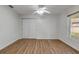 Bright bedroom with wood-look floors, large closet, and window at 2853 Turnbull Estates Dr, New Smyrna Beach, FL 32168