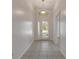 Bright and airy entryway with tiled floors at 2853 Turnbull Estates Dr, New Smyrna Beach, FL 32168