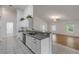 Kitchen with white shaker cabinets, gray countertops, and stainless steel appliances at 2853 Turnbull Estates Dr, New Smyrna Beach, FL 32168