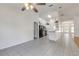 Open kitchen with black appliances and white cabinets at 2853 Turnbull Estates Dr, New Smyrna Beach, FL 32168