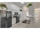 Well-equipped kitchen featuring white cabinets and stainless steel appliances at 2853 Turnbull Estates Dr, New Smyrna Beach, FL 32168