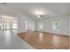 Open living area with hardwood floors and high ceilings at 2853 Turnbull Estates Dr, New Smyrna Beach, FL 32168