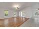 Spacious living room with wood-look floors and lots of natural light at 2853 Turnbull Estates Dr, New Smyrna Beach, FL 32168